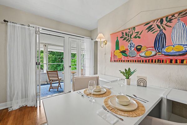 Dining nook in Apartment 3S with French doors to the covered porch